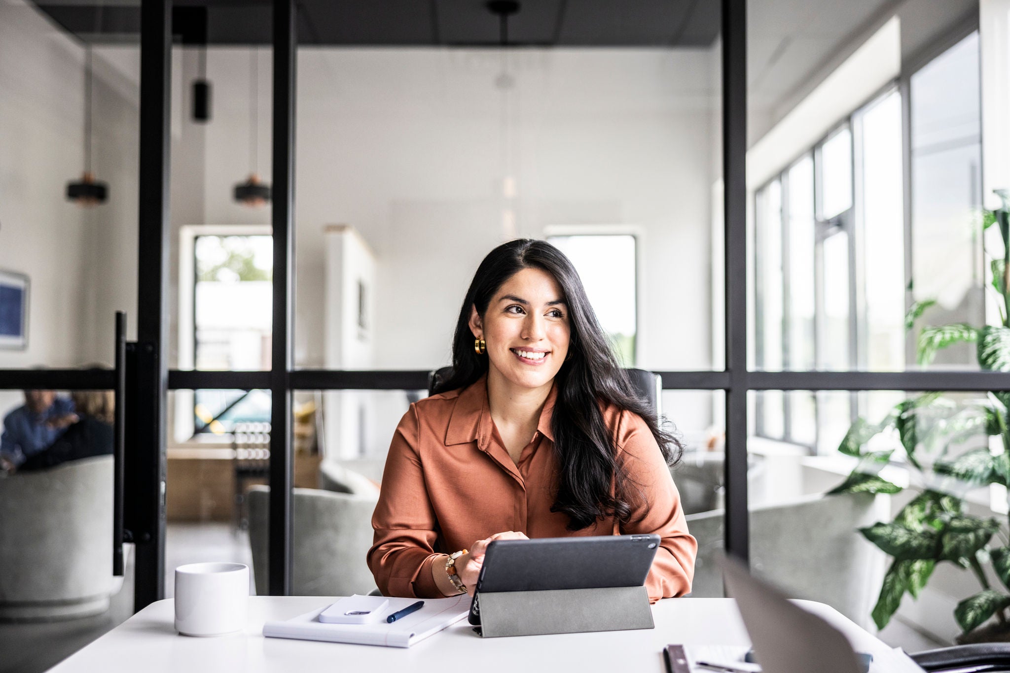 Portrait of businesswoman in modern conference room